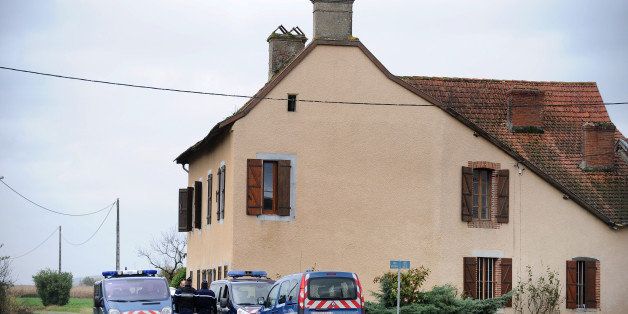 French Gendarmes stand, on November 15, 2013 in the southern town of Nouilhan, in front of the house where a farmer was killed overnight. An 26-year homeless man killed the 90-year man before taking his tongue and his heart to eat, according to investigators. The killer assaulted another person on his tractor, breaking his shoulder, before being arrested.AFP PHOTO / REMY GABALDA (Photo credit should read REMY GABALDA/AFP/Getty Images)