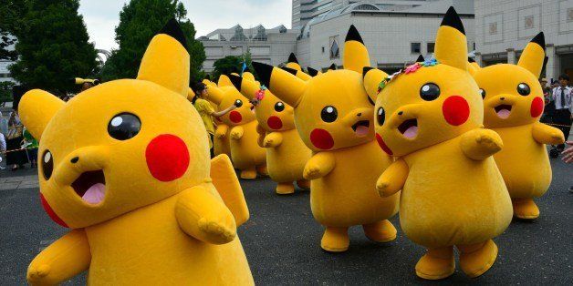 Dozens of Pikachu characters, the famous character of Nintendo's videogame software Pokemon, parade at the Landmark Plaza shopping mall in Yokohama, suburban Tokyo on August 14, 2014. The Pikachu mascots walk around daily to attract summer vacationers as a part of the 'Great Pikachu Outbreak' event through the weekend. AFP PHOTO / Yoshikazu TSUNO (Photo credit should read YOSHIKAZU TSUNO/AFP/Getty Images)