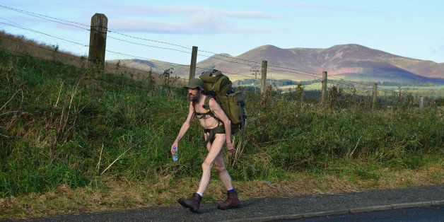 PEEBLES, SCOTLAND - OCTOBER 06: (EDITOR'S NOTE: Image contains nudity) Stephen Gough the naked rambler makes his way south through the Scottish Borders, following his release from Saughton Prison yesterday after serving his latest sentence on October 6, 2012 in Peebles, Scotland. The rambler has 18 convictions and has been in prison on and off since 2006 with offences ranging from not wearing clothes in front of the sheriff, breach of the peace and contempt of court. (Photo by Jeff J Mitchell/Getty Images)