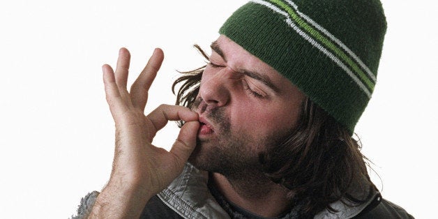 Man pretending to smoke marijuana