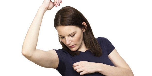 Woman sweating very badly under armpit