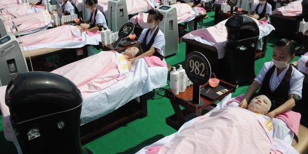 JINAN, CHINA - MAY 04: (CHINA OUT) People wear facial masks for the sake of beauty on May 4, 2015 in Jinan, Shandong province of China. A thousand people wore facial masks at the same time, which has broke the the Guinness Book of Records in Jinan on Monday. (Photo by ChinaFotoPress/ChinaFotoPress via Getty Images)