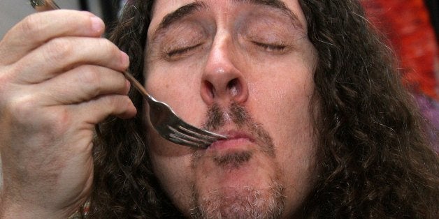 LOS ANGELES, CA - NOVEMBER 20: Musician Weird Al Yankovic poses with the Mrs. Smith display backstage at the American Music