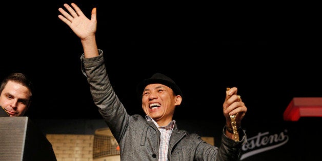 Christian Pham celebrates during a bracelet ceremony after he won the World Series of Poker No-Limit Deuce-to-Seven Lowball Draw tournament Friday, June 12, 2015, in Las Vegas. Pham accidentally entered the No-Limit Deuce-to-Seven Lowball Draw tournament while trying to register for another. (AP Photo/John Locher)