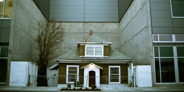 Decided to check this out after reading this article on the houseI feel sorry for this little house, totally dwarfed by the new construction around it. I hope they let it stay, but I doubt that will happen.