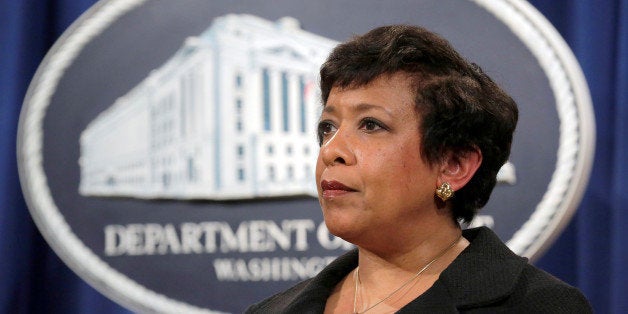 Attorney General Loretta E. Lynch stands during the announcement of law enforcement action against the state of North Carolin