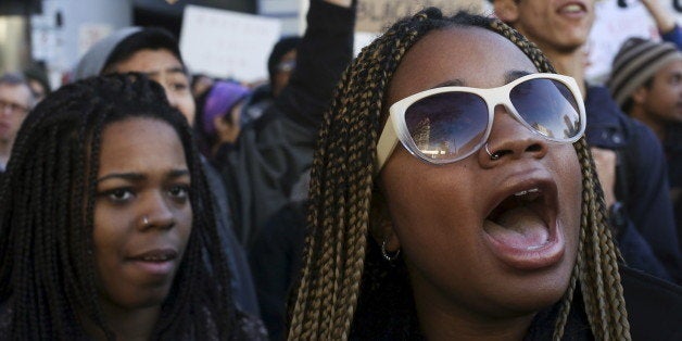 Black Lives Matter protesters shout during Black Friday in Seattle, Washington November 27, 2015. REUTERS/David Ryder