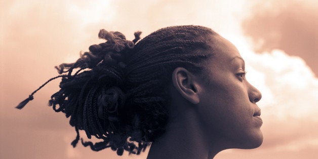 Profile of woman and clouds