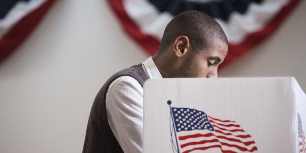 Hispanic voter voting in polling place