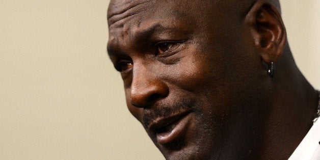 Charlotte Hornets owner Michael Jordan responds to a question during a news conference on on Tuesday, Oct. 28, 2014, at Time