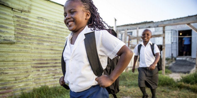 African primary school kids in theirs uniforms going to school. Image from South Africa.