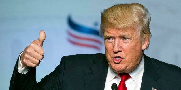 FILE - In this June 10, 2016 file photo, Republican presidential candidate Donald Trump gives a thumbs-up while addressing the Faith and Freedom Coalition's Road to Majority Conference in Washington. Presumptive Republican presidential nominee Donald Trump boils down his foreign policy agenda to two words: âAmerica First.â For students of U.S. history, that slogan harkens back to the tumultuous presidential election of 1940, when hundreds of thousands of Americans joined the anti-war America First Committee. That isolationist groupâs primary goal was to keep the United States from joining Britain in the fight against Nazi Germany, which by then had overrun nearly all of Europe. But the committee is also remembered for the unvarnished anti-Semitism of some of its most prominent members and praise for the economic policies of Adolf Hitler.(AP Photo/Cliff Owen, File)