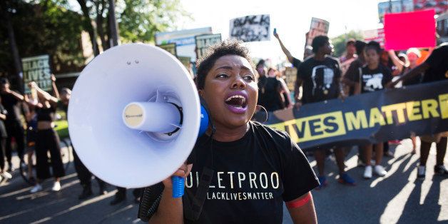 TORONTO, ON- JULY 27 - Pascale Diverlus yells into microphones during a Black Lives Matter protest that marched from Gilbert Avenue to Allen Road on Eglinton Avenue. The protest shut down the southbound Allen Road for around 30 minutes, causing traffic to reverse and exit through Lawrence Avenue. (Melissa Renwick/Toronto Star via Getty Images)