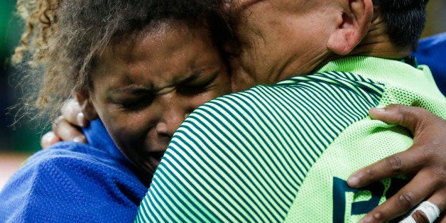 Brazil's Rafaela Silva, left, reacts after winning the gold medal of the women's 57-kg judo competition at the 2016 Summer Olympics in Rio de Janeiro, Brazil, Monday, Aug. 8, 2016. (AP Photo/Markus Schreiber)