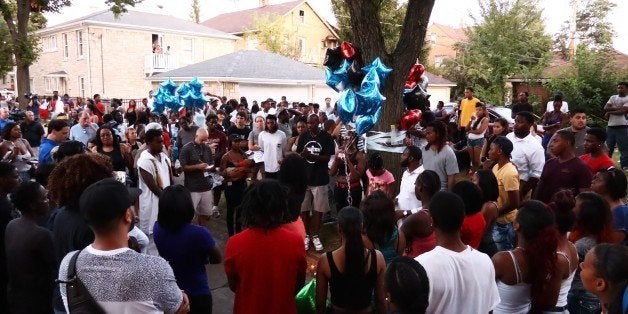 MILWAUKEE, WISCONSIN, USA - AUGUST 15: People gather and pray during a commemoration ceremony, held for Sylville Smith, who was shot and killed by a police officer as he reportedly attempted to flee after he was pulled over by police during a traffic stop Saturday afternoon, in Wisconsin, Milwaukee, USA on August 15, 2016. (Photo by Bilgin S. Sasmaz/Anadolu Agency/Getty Images)