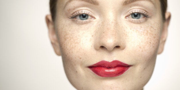 Young woman wearing bright red lipstick, portrait