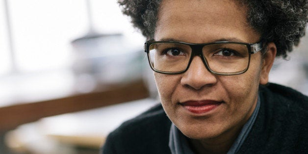 Close-up portrait of female black small business owner. Woman owns a fashion design studio