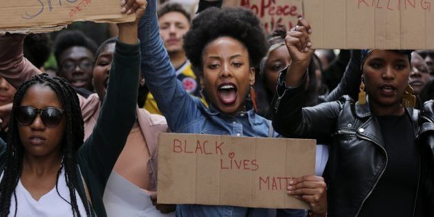 TOPSHOT - Demonstrators from the Black Lives Matter movement march through central London on July 10, 2016, during a demonstration against the killing of black men by police in the US. Police arrested scores of people in demonstrations overnight Saturday to Sunday in several US cities, as racial tensions simmer over the killing of black men by police. / AFP / DANIEL LEAL-OLIVAS (Photo credit should read DANIEL LEAL-OLIVAS/AFP/Getty Images)