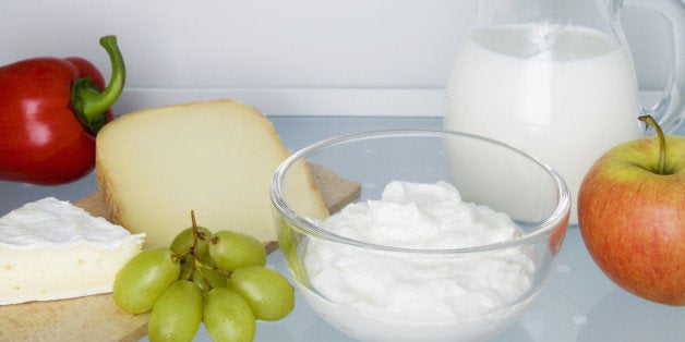 Fridge filled with dairy product eggs fruits and vegetable