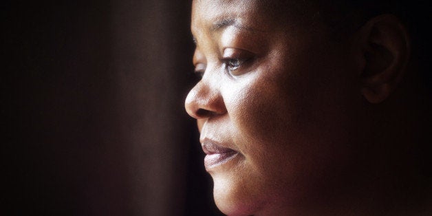 portrait of mature woman of African descent with thoughtful expression