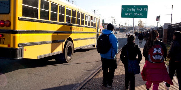 Students leave Normandy High School, where Mike Brown graduated.The northern St. Louis suburb of Ferguson, Missouri anxiously awaits a grand jury verdict to be released three months after the fatal shooting of a local teenager, Michael Brown, by a Ferguson police officer. The shooting has increased racial tensions in the small city, and brought to the surface resentment of the mostly white police force. (Photo by Andrew Lichtenstein/Corbis via Getty Images)