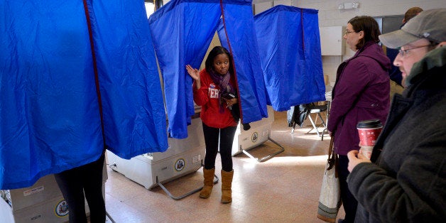A voter leaves the polling booth during the U.S. presidential election in Philadelphia, Pennsylvania, U.S. November 8, 2016.