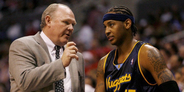 Denver Nuggets head coach George Karl (L) talks with Carmelo Anthony during a time out of their 98-87 loss to the Los Angeles