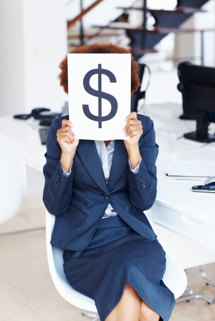 business woman holding dollar...