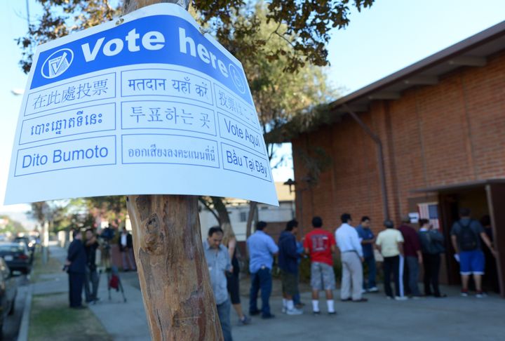 Sun Valley residents wait in line to vote at the polling station located at Our Lady of The Holy Church on election day at the Sun Valley's Latino district, Los Angeles County, on November 6, 2012 in California.AFP PHOTO /JOE KLAMAR (Photo credit should read JOE KLAMAR/AFP/Getty Images)