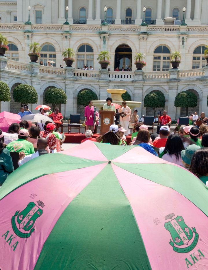 UNITED STATES - JULY 17: From left, Rep. Sheila Jackson-Lee, D-Texas, Rep. Diane Watson, D-Calif, and Rep. Eddie Bernice Johnson, D-Texas, speak at the centennial celebration and unity march of Alpha Kappa Alpha (AKA) Sorority, the nation's first Greek-letter organization founded by African American college women, on the West Front of the Capitol on Thursday, July 17, 2008. (Photo By Bill Clark/Roll Call/Getty Images)