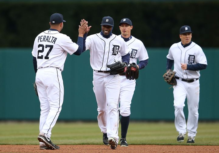 DETROIT, MI - APRIL 11: Austin Jackson #14 of the Detroit Tigers celebrates with teammate Jhonny Peralta #27 after the Tigers defeated the Blue Jays at Comerica Park on April 11, 2013 in Detroit, Michigan. The Tigers defeated the Blue Jays 11-1. (Photo by Leon Halip/Getty Images)