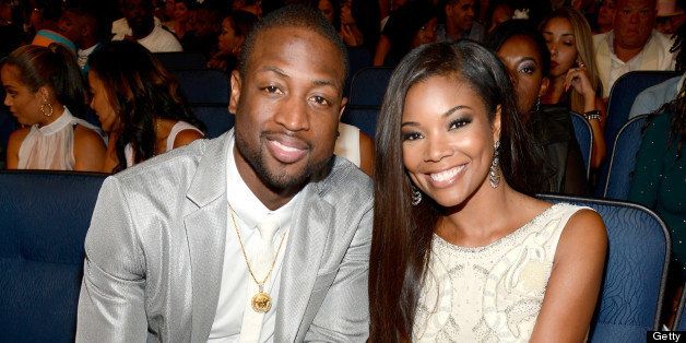 LOS ANGELES, CA - JUNE 30: BET Humanitarian Award Recipient Dwyane Wade (L) and actress Gabrielle Union attend the 2013 BET Awards at Nokia Theatre L.A. Live on June 30, 2013 in Los Angeles, California. (Photo by Kevin Mazur/Getty Images for BET)