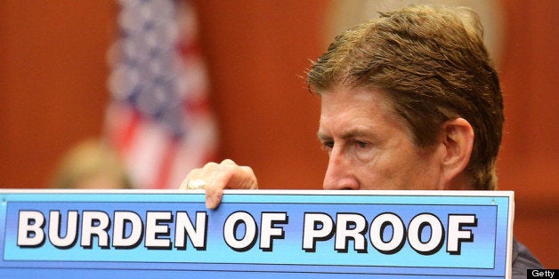 SANFORD, FL - JULY 12: Defense attorney Mark O'Mara holds up a chart during closing arguments for the defence in Zimmerman's murder trial July 12, 2013 in Sanford, Florida. Judge Debra Nelson has ruled that the jury can also consider a lesser manslaughter charge along with the second-degree murder charge in the shooting death of Trayvon Martin. (Photo by Joe Burbank-Pool/Getty Images)