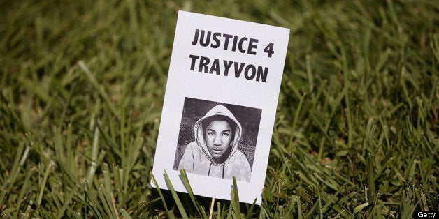 SANFORD, FL - JULY 13: A sign showing support for Trayvon Martin is stuck in the lawn in front of the Seminole County Criminal Justice Center where a jury is deliberating in the trial of George Zimmerman on July 13, 2013 in Sanford, Florida. Zimmerman, a neighborhood watch volunteer, is on trial for the February 2012 shooting death of 17-year-old Trayvon Martin. (Photo by Scott Olson/Getty Images)