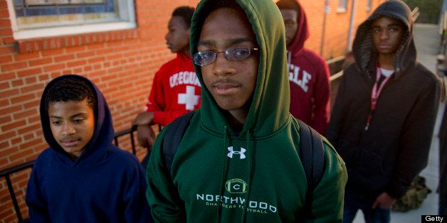 PITTSBORO, NC - MARCH 28: (L-R) Devante Gray, Raekwan Gray, Jalen Gipson, Jaylnn Davis and Camren Watson attend a Hoodie Rally and Prayer Vigil for Justice in honor of Trayvon Martin through the Mitchell Chapel AME Zion Church on March 28, 2012 in Pittsboro, North Carolina. Martin was killed by George Michael Zimmerman who was on neighborhood watch patrol in the gated community of The Retreat at Twin Lakes, Florida. (Photo by Ann Hermes/The Christian Science Monitor via Getty Images)