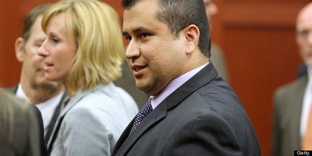 SANFORD, FL - JULY 13: George Zimmerman leaves the courtroom a free man after being found not guilty, on the 25th day of his trial at the Seminole County Criminal Justice Center July 13, 2013 in Sanford, Florida. Zimmerman was charged with second-degree murder in the 2012 shooting death of Trayvon Martin. (Photo by Joe Burbank-Pool/Getty Images)