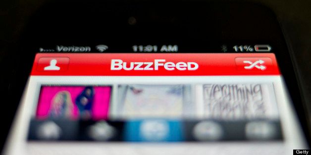 The BuzzFeed app is displayed on an Apple Inc. iPhone 5 in Tiskilwa, Illinois, U.S., on Thursday, May 30, 2013. New York Times Co., looking to imitate the business models used by startups such as BuzzFeed Inc., is considering letting advertisers sponsor more stories on its website, two people with knowledge of the situation said. Photographer: Daniel Acker/Bloomberg via Getty Images
