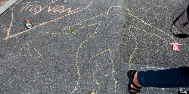 WASHINGTON DC - JULY 20: A chalk drawing decorates the sidewalk next to a 'Justice for Trayvon' vigil sponsored by The Natio