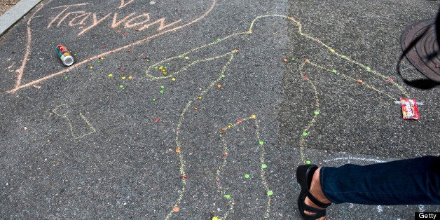 WASHINGTON DC - JULY 20: A chalk drawing decorates the sidewalk next to a 'Justice for Trayvon' vigil sponsored by The National Action Network, in front of the E. Barrett Prettyman Federal Courthouse on July 20, 2013 in Washington, DC. (Photo by Mary F. Calvert, For The Washington Post via Getty Images )