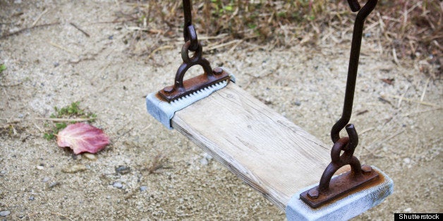 wooden swing chair in autumn...