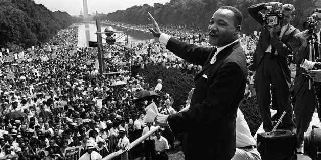 The civil rights leader Martin Luther KIng (C) waves to supporters 28 August 1963 on the Mall in Washington DC (Washington Monument in background) during the 'March on Washington'. King said the march was 'the greatest demonstration of freedom in the history of the United States.' Martin Luther King was assassinated on 04 April 1968 in Memphis, Tennessee. James Earl Ray confessed to shooting King and was sentenced to 99 years in prison. King's killing sent shock waves through American society at the time, and is still regarded as a landmark event in recent US history. AFP PHOTO (Photo credit should read -/AFP/Getty Images)