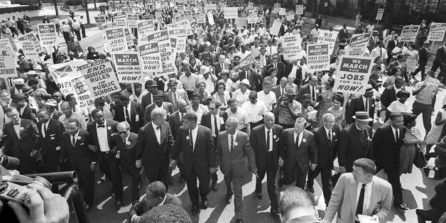 WASHINGTON, : US civil rights leader Martin Luther King,Jr. (3rd from L) walks with supporters during the 'March on Washington' 28 August, 1963 after which, King delivered the 'I Have a Dream' speech from the steps of the LIncoln Memorial. 28 August, 2003 marks the 40th anniversary of the famous speech, which is credited with mobilizing supporters of desegregation and prompted the 1964 Civil Rights Act. King was assassinated on 04 April 1968 in Memphis, Tennessee. James Earl Ray confessed to shooting King and was sentenced to 99 years in prison. AFP PHOTO/FILES (Photo credit should read AFP/AFP/Getty Images)