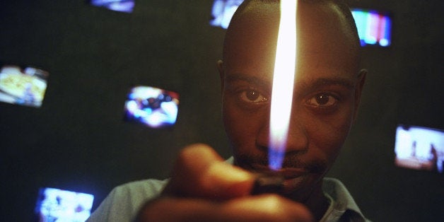 UNITED STATES - CIRCA 2000: Comedian Dave Chappelle enjoys a light moment at the HBO offices on Sixth Ave. (Photo by James