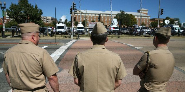WASHINGTON, DC - SEPTEMBER 17: Three members of the U.S. Navy walk out of the front gate of the Washington Naval Yard September 17, 2013 in Washington, DC. esterday a defense contractor named Aaron Alexis allegedly killed at least 12 people during a shooting rampage at the Navy Yard before being killed by police. (Photo by Mark Wilson/Getty Images)