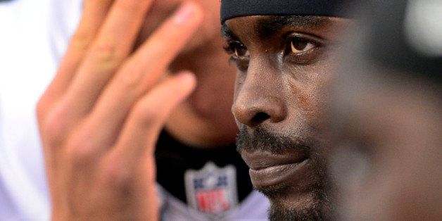DENVER, CO - SEPTEMBER 29: Philadelphia Eagles quarterback Michael Vick (7) looks dejected while sitting on the bench during their loss to the Denver Broncos 52-20 September 29, 2013 at Sports Authority Field at Mile High. (Photo by AAron Ontiveroz/The Denver Post via Getty Images)