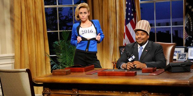 SATURDAY NIGHT LIVE -- 'Miley Cyrus' Episode 1643 -- Pictured: (l-r) Miley Cyrus as Hillary Clinton, Kenan Thompson as Sway Calloway -- (Photo by: Dana Edelson/NBC/NBCU Photo Bank via Getty Images)