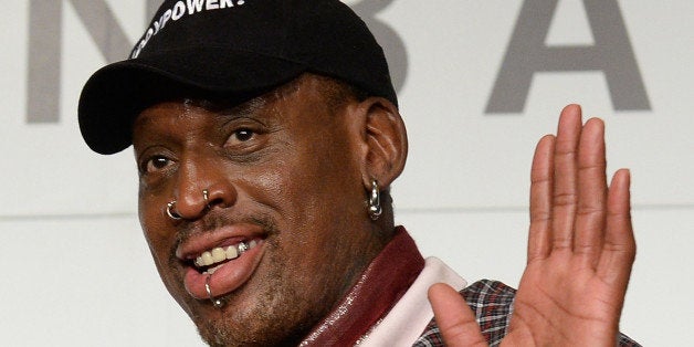 Former NBA star Dennis Rodman poses during a press conference in Tokyo on October 25, 2013. Rodman is here to promote NBA ahead of the season opening games on October 30. AFP PHOTO/Toru YAMANAKA (Photo credit should read TORU YAMANAKA/AFP/Getty Images)