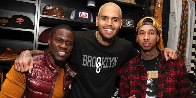 LOS ANGELES, CA - DECEMBER 22: (L-R) Comedian Kevin Hart, singer Chris Brown, and rapper Tyga attend the 1st Annual Xmas Toy Drive hosted by Chris Brown and Brooklyn Projects on December 22, 2013 in Los Angeles, California. (Photo by Imeh Akpanudosen/Getty Images)