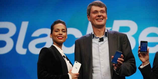 NEW YORK, NY - JANUARY 30: BlackBerry President and Chief Executive Officer Thorsten Heins (R) stands with new BlackBerry Global Creative Director Alicia Keys at the BlackBerry 10 launch event at Pier 36 in Manhattan on January 30, 2013 in New York City. The new smartphone and mobile operating system is being launched simultaneously in six cities. (Photo by Mario Tama/Getty Images)