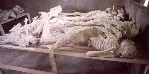 A group of mummified bodies lie on a table in a school building that was the scene of a massacre during the genocide in Rwanda, Murambi, Province of Gikongoro, circa 1994. (Photo by Lane Montgomery/Getty Images)